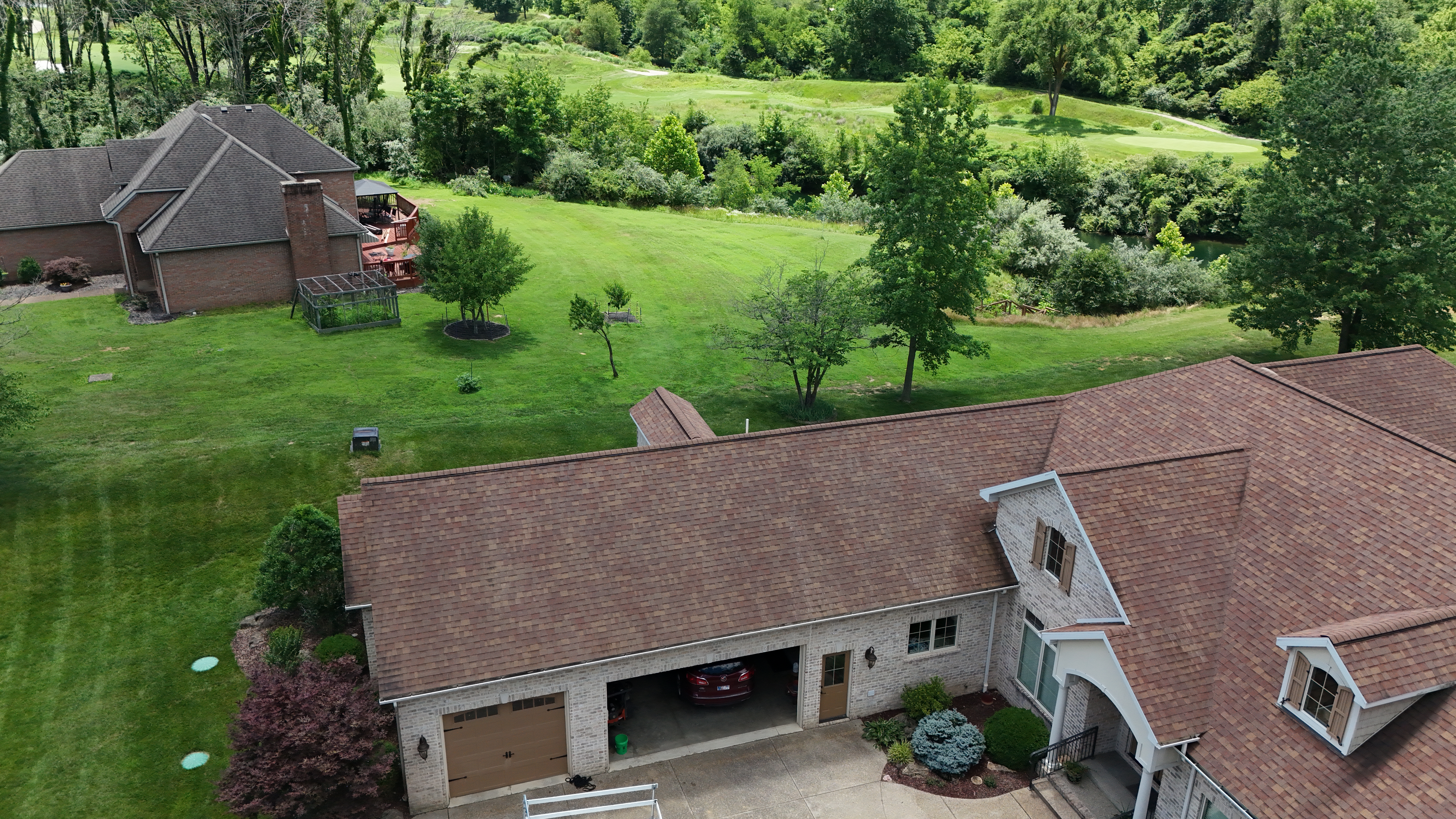 Algae-stained roof before drone soft wash