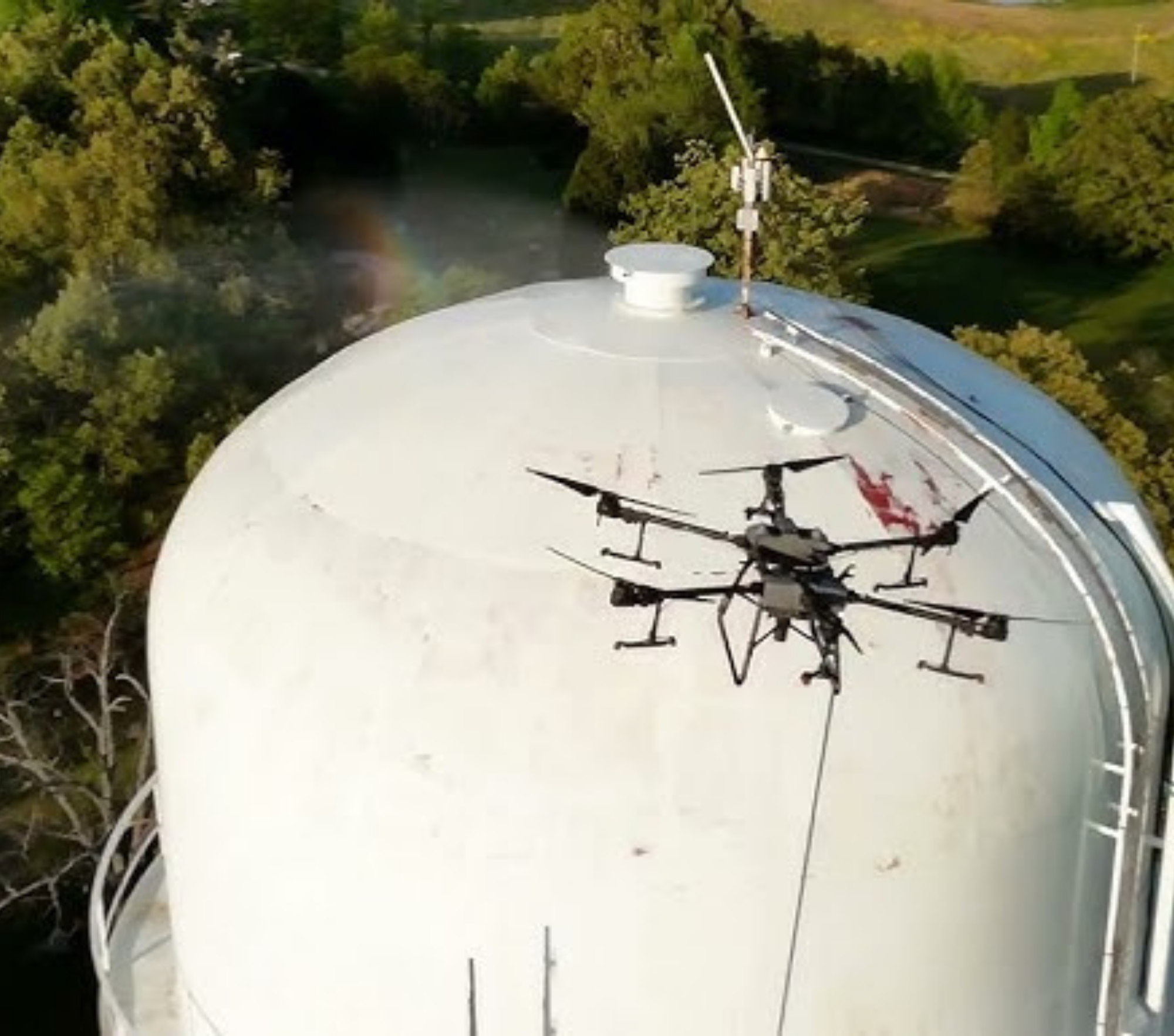 Drone cleaning a water tower